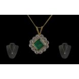 A Superb 18ct Gold Diamond and Emerald Set Pendant - Attached to a 18ct Gold Chain.