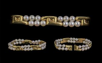 A Superb Quality Ladies Signed 18ct And Cultured Pearl Set Bracelet Of Cotemporary Design.