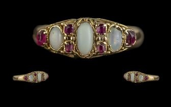 An Antique 18ct Gold Opal & Ruby Ring, three opals set between ruby spacers.