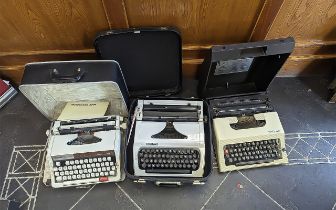 Three Vintage Typewriters, all in cases, makes include Erika, Texet and Brother 1510.