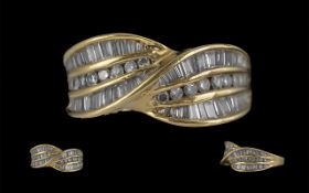 14ct Gold - Contemporary Designed Brilliant and Baguette Cut Diamond Set Dress Ring.