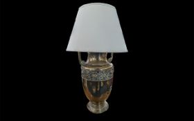 Antique Brass Table Lamp, urn shaped, floral engraved decoration to middle. Measures approx.