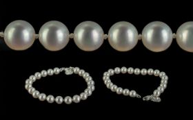 Tiffany & Co. Pearl Bracelet, with 18ct white gold clasp and white gold maker's circular tag