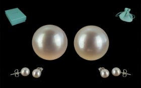 Tiffany & Co. Pair of Pearl Studs, set in 18ct white gold, for pierced ears. In original Tiffany