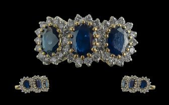 Ladies 18ct Yellow Gold Diamond and Sapphire Cluster Set Ring, full hallmark to interior of shank;