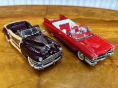 Two Danbury Mint Collector's Classic Cars, a 1959 Cadillac Series 62 in red, and a 1948 Chrysler