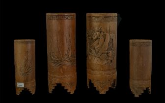 Two Oriental Carved Bamboo Vases, decorated with figures and ships, measure 10.5" tall.