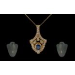 A Superb 18ct Gold Attractive Diamond and Sapphire Set Pendant Drop - Attached to a 18ct Gold Chain.