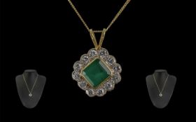 A Superb 18ct Gold Diamond and Emerald Set Pendant - Attached to a 18ct Gold Chain. Both Marked