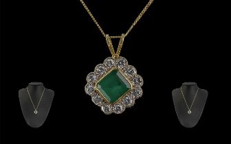A Superb 18ct Gold Diamond and Emerald Set Pendant - Attached to a 18ct Gold Chain. Both Marked