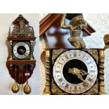 Antique Cuckoo Clock, Roman numerals, brass weights, brass twist supports, top depicting a figure of