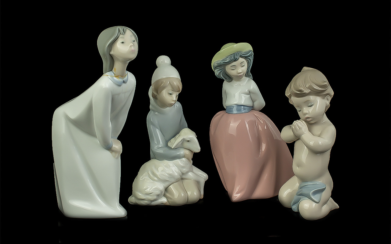Three Lladro Figures & a Nao Figure, comprising Lladro 6496 figure of a baby boy, Lladro 4676