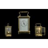 Matthew Norman of London Brass Cased Carriage Clock, white face with Roman numerals. Measures 7.