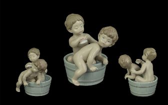 Lladro Figure No. 6411 'Bath time' showing to toddlers in a tub, measures approx 5'' high, in good