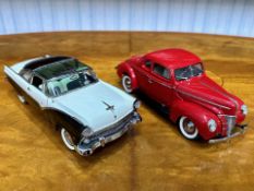 Two Danbury Mint Collector's Classic Cars, a 1940 Ford Deluxe Coupe in red, and a 1955 Ford Fairlane