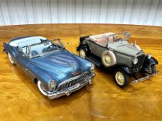 Two Danbury Mint Collector's Classic Cars, a 1931 Ford Model A Roadster in tan, and a 1953 Buick