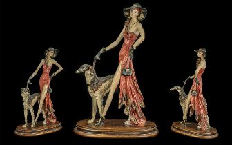 Modern Decorative Figure of a Glamorous Lady Walking her Dog, measures 18'' tall, 12'' wide, mounted