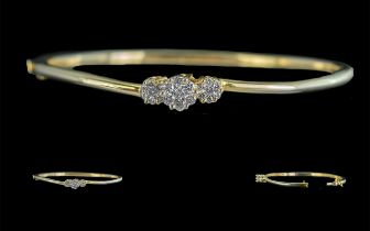 14ct Gold Good Quality Diamond Set Hinged Bangle, marked 14ct, with three diamond set clusters of