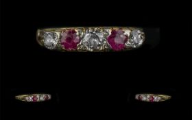 Ladies 18ct Gold and Platinum Attractive 5 Stone Diamond and Ruby Set Dress Ring. Marked 18ct and