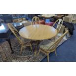 Blonde Ercol Elm & Beech Circular Table and Four Chairs, table diameter 48''. Four high back spindle