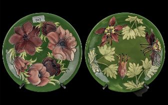 Two Moorcroft Plates, 10'' diameter, one dark green with Honeysuckle pattern, one dark green with