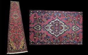 Washed Red Ground Multi Coloured Persian Runner, measures 317 x 69.