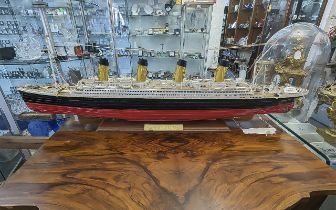 Scratch Built Model of the Titanic, mounted on a wooded base with plaque to front. Measures 43''