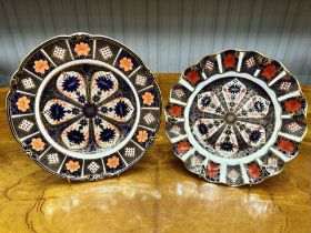 Two Royal Crown Derby Plates comprising a 9'' circular shaped edge and an 8'' scalloped edge plate.