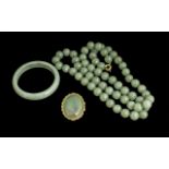 Jade Bead Necklace, together with a bangle and brooch.