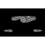 18ct White Gold Diamond Solitaire Twist Ring with diamond shoulders. Diamond weight 0.38ct approx.