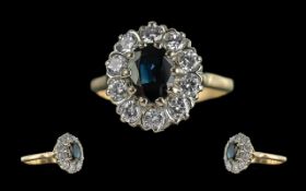 Ladies 18ct Gold Attractive Sapphire and Diamond Set Cluster Ring. Marked 18ct to Shank. The Central