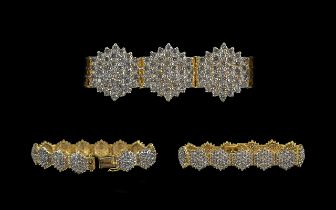 Ladies Modern 18ct Yellow Gold Diamond Cluster Set Bracelet, consisting of thirteen diamond clusters