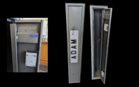 A Gun Safe/Cabinet Complete with keys and mounts, height 51.5'' x 8.75'' x 8''.