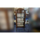 Edwardian Bow Fronted Display Cabinet, glazed front and sides, raised on tapered legs. Height