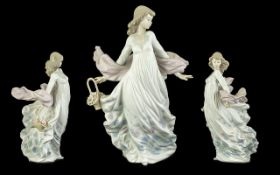Lladro 'Spring Splendour' Figurine No. 5898, depicts a lady with the wind blowing her shawl,