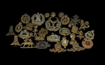 Collection of Military Cap Badges including Royal Artillery Cap Badges with sliders, cap badges,