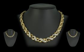 18ct Gold & Diamond Set Necklace, figure of eight design, marked 750 - 18ct. Set with over 1.50 ct