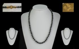 A Superb Victorian Period Whitby Jet Necklace, with 18ct Gold Clasp, marked for 18ct. Length