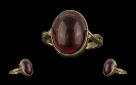 A Good Quality 9ct Gold Single Stone Ruby-Lite Set Ring - The Large Cabochon Cut Ruby Lite of
