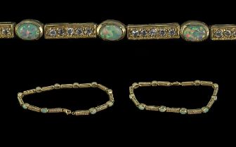 14ct Gold - Attractive Opal and Diamond Set Line Bracelet, Marked 14ct. The Ten Well Matched Opals