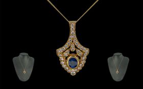 A Superb 18ct Gold Attractive Diamond and Sapphire Set Pendant Drop - Attached to a 18ct Gold Chain.