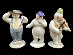 Three Royal Doulton Snowman Figures, comprising Lady Snowman, Violinist Snowman and Stylish