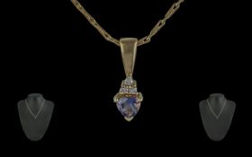 Ladies Attractive 9ct Gold Tanzanite and Diamond Set Pendant of Small Proportions. Attached to a 9ct