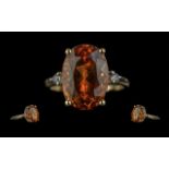 Ladies Excellent 10ct Gold Orange Topaz and Diamond Set Ring. Marked 10ct to Shank. The Oval