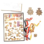 Group of five medals, including the Atlantic Star; Leicestershire Regiment badges, etc