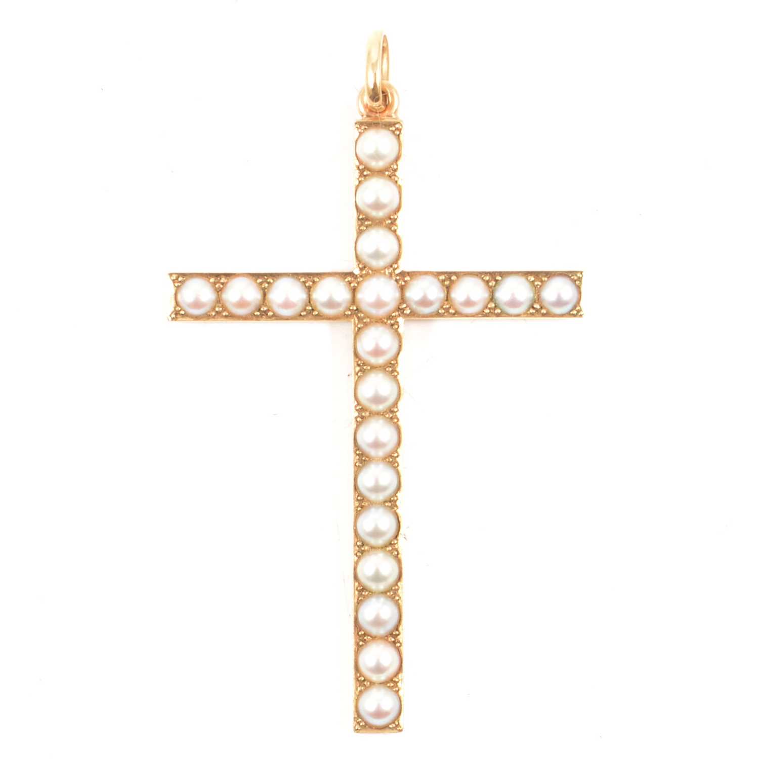 A large 9 carat gold pearl set cross.