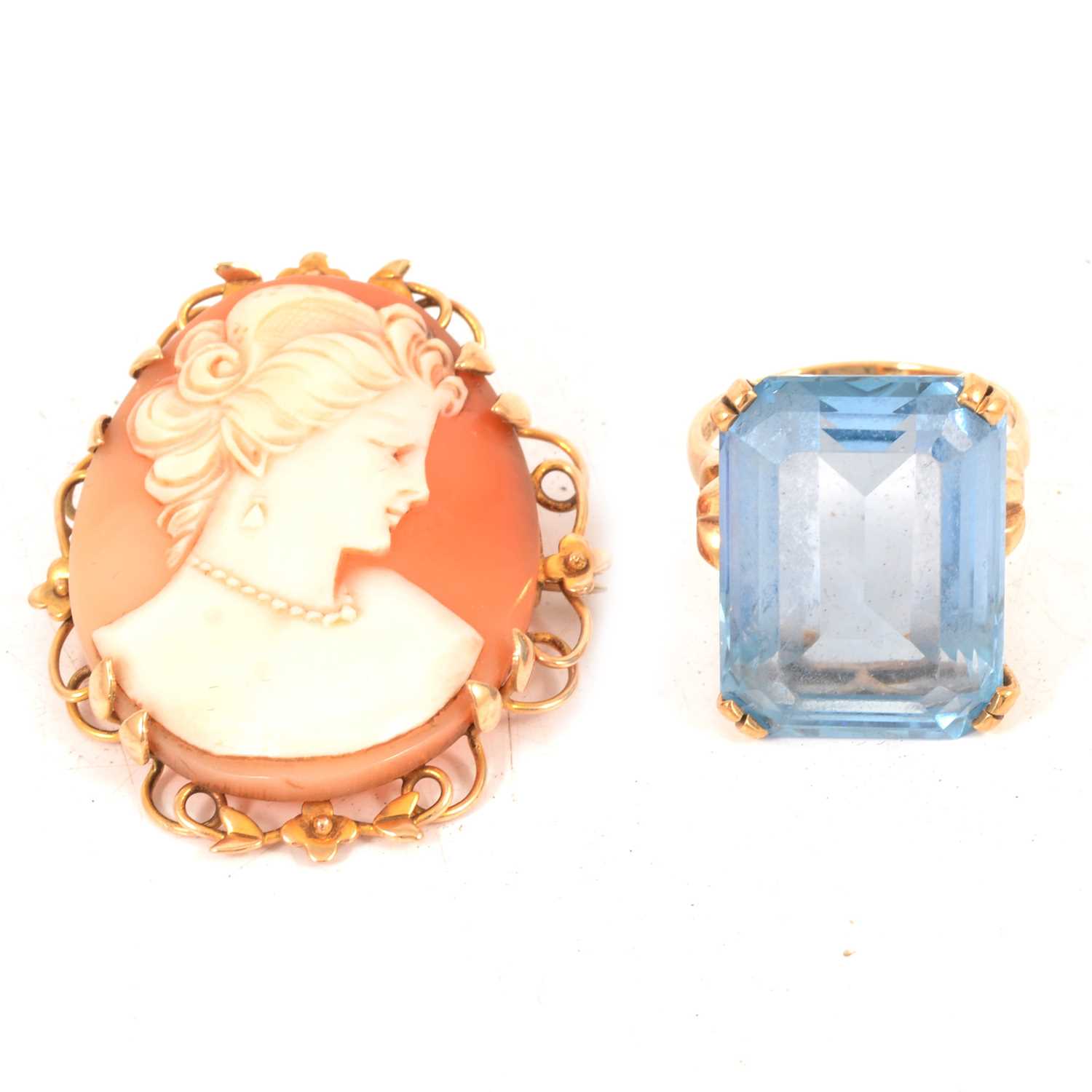 A synthetic blue spinel ring and a shell cameo brooch.