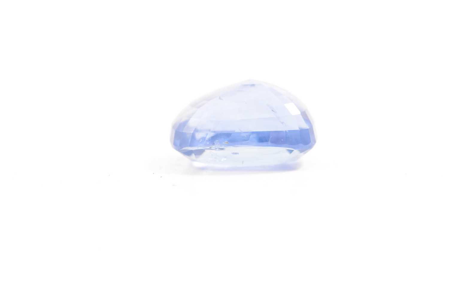 A loose blue sapphire stone - 12.25 carats. - Image 6 of 8