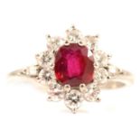 A ruby and diamond cluster ring.