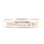 A diamond half eternity ring.